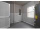 Utility room featuring window, water heater, and electrical panel at 6334 Milo Dr, Austell, GA 30168