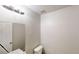 Neutral bathroom featuring a vanity with mirror, toilet, and modern lighting at 6643 Hill Creek Cv, Lithonia, GA 30058