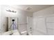 Neutral bathroom featuring a vanity with mirror, tub/shower, and modern lighting at 6643 Hill Creek Cv, Lithonia, GA 30058