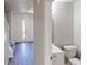 Functional hall bathroom featuring a toilet and sink with a cabinet for storage at 6643 Hill Creek Cv, Lithonia, GA 30058