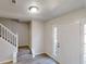 Inviting entryway with a white front door, staircase and hardwood floors at 6643 Hill Creek Cv, Lithonia, GA 30058