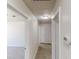 Upstairs hallway featuring carpet and doors leading to the bedrooms at 6643 Hill Creek Cv, Lithonia, GA 30058
