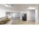 Open concept kitchen featuring modern sink, hardwood floors and connections to other spaces at 6643 Hill Creek Cv, Lithonia, GA 30058