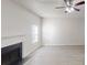Spacious living room boasts a charming fireplace and ceiling fan at 6643 Hill Creek Cv, Lithonia, GA 30058