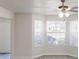 Sun-filled living room featuring hardwood floors and bright windows at 6643 Hill Creek Cv, Lithonia, GA 30058