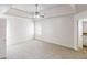 Expansive main bedroom with tray ceiling, fan, carpet and ample natural light at 6643 Hill Creek Cv, Lithonia, GA 30058