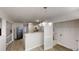 Well-lit dining area with chandelier conveniently adjoins kitchen and laundry area at 6643 Hill Creek Cv, Lithonia, GA 30058