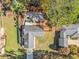 Aerial view of a home with a patio and mature trees in a private backyard at 284 Regal Dr, Lawrenceville, GA 30046