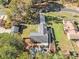 Aerial view of a home with a long driveway and surrounding trees at 284 Regal Dr, Lawrenceville, GA 30046