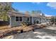 Backyard with a patio, mature trees, barbecue grill and stone pavers at 284 Regal Dr, Lawrenceville, GA 30046