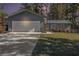 Charming home features a two-car garage, fresh landscaping, and a freshly sealed driveway at 284 Regal Dr, Lawrenceville, GA 30046