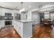 Modern kitchen with white cabinetry, granite countertops, stainless steel appliances, and hardwood flooring at 284 Regal Dr, Lawrenceville, GA 30046