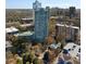 Expansive aerial view showcasing tall buildings, a tennis court, and beautifully landscaped surroundings at 2870 Pharr Court South Nw # 1202, Atlanta, GA 30305