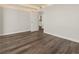 Spacious bedroom showcasing hardwood floors and ample natural light from an open doorway at 2870 Pharr Court South Nw # 1202, Atlanta, GA 30305