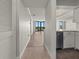 Hallway view into the kitchen and living area with hardwood floors and stainless steel appliances at 2870 Pharr Court South Nw # 1202, Atlanta, GA 30305