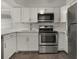 Modern kitchen featuring stainless steel appliances, white cabinets, and quartz countertops at 2870 Pharr Court South Nw # 1202, Atlanta, GA 30305