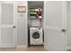 Laundry area featuring a newer model washer and storage shelves at 2870 Pharr Court South Nw # 1202, Atlanta, GA 30305