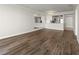 Bright living room features updated hardwood floors, neutral paint, and an open floor plan at 2870 Pharr Court South Nw # 1202, Atlanta, GA 30305