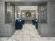 Inviting lobby area with elegant decor, comfortable blue armchairs, and decorative lighting at 2870 Pharr Court South Nw # 1202, Atlanta, GA 30305
