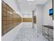 Well-lit mailroom featuring rows of mailboxes, marble floors, and clean white walls at 2870 Pharr Court South Nw # 1202, Atlanta, GA 30305