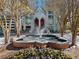 Water feature in front of building with landscaped flowers and multiple trees at 2870 Pharr Court South Nw # 1202, Atlanta, GA 30305