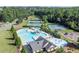 Aerial view showcasing a community pool, tennis courts, and playground surrounded by mature trees and green spaces at 525 Appalachian Pl, Canton, GA 30114