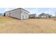 Expansive backyard featuring a well-maintained lawn and the home's exterior at 525 Appalachian Pl, Canton, GA 30114