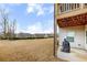Large backyard with patio and grill with views of neighboring homes and mature landscaping at 525 Appalachian Pl, Canton, GA 30114