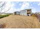 Spacious backyard showcasing the home's exterior and a sizable lawn area at 525 Appalachian Pl, Canton, GA 30114