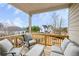 Relax on this covered balcony with comfortable seating and enjoy neighborhood views at 525 Appalachian Pl, Canton, GA 30114