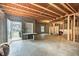 Unfinished basement with walk-out access to the backyard through French doors, and a small desk at 525 Appalachian Pl, Canton, GA 30114