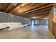 Unfinished basement offering ample storage and potential for customization with walkout to backyard at 525 Appalachian Pl, Canton, GA 30114
