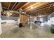 Spacious unfinished basement with exposed wood ceiling and walls offers lots of potential at 525 Appalachian Pl, Canton, GA 30114