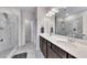 Modern bathroom with dual sinks, granite countertops, and a tiled shower at 525 Appalachian Pl, Canton, GA 30114