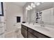 Bathroom featuring a double sink vanity, white countertop, and ample lighting, with a tile floor at 525 Appalachian Pl, Canton, GA 30114