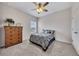 This bedroom features a carpeted floor, double door closet, and a dresser for ample storage at 525 Appalachian Pl, Canton, GA 30114