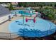 Aerial view of a community pool area featuring a splash pad and comfortable seating at 525 Appalachian Pl, Canton, GA 30114