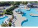Wide aerial shot of community pool, waterslide, splashpad, lounge chairs and playground at 525 Appalachian Pl, Canton, GA 30114