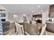 Open concept dining room adjacent to the modern kitchen and living area at 525 Appalachian Pl, Canton, GA 30114