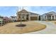 Inviting home exterior with a covered porch, a garage, and a green lawn at 525 Appalachian Pl, Canton, GA 30114