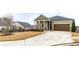 Attractive home with stone accents, a cozy porch, and a neatly maintained lawn at 525 Appalachian Pl, Canton, GA 30114