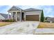 Charming single-Gathering home with a well-manicured lawn and a two-car garage at 525 Appalachian Pl, Canton, GA 30114