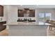 Modern kitchen featuring a large island with granite countertops and stainless steel appliances at 525 Appalachian Pl, Canton, GA 30114