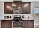 Kitchen with stainless steel appliances and granite countertops at 525 Appalachian Pl, Canton, GA 30114