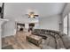 Open concept living room with hardwood floors seamlessly connects to the kitchen at 525 Appalachian Pl, Canton, GA 30114