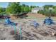 Community playground with swings, slides, and other play equipment, plenty of mulch, and surrounding greenery at 525 Appalachian Pl, Canton, GA 30114