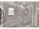 Walk-in shower with tiled walls, a rainfall showerhead, and glass enclosure at 525 Appalachian Pl, Canton, GA 30114