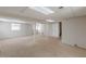 Spacious basement with neutral carpet, support columns, and natural light from egress windows at 6108 Mount Zion Blvd, Ellenwood, GA 30294