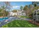 Expansive backyard with lush lawn, swimming pool, and beautiful gazebo, ideal for outdoor enjoyment at 890 W Wesley Nw Rd, Atlanta, GA 30327