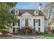 Beautiful home exterior featuring a symmetrical facade, dormer windows, and manicured landscaping at 890 W Wesley Nw Rd, Atlanta, GA 30327